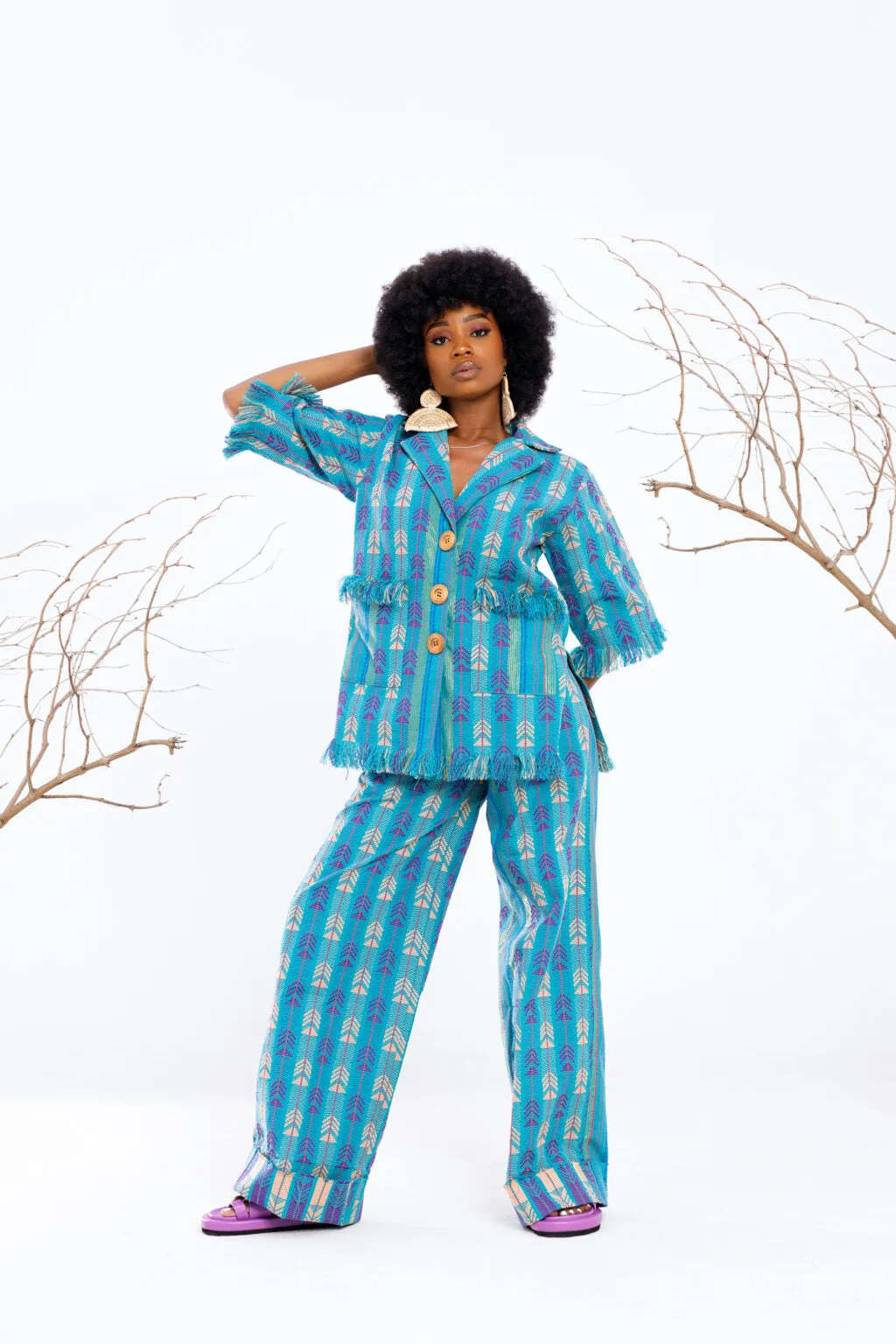 Atuche Osisi wooden set with an oversized shirt and trousers