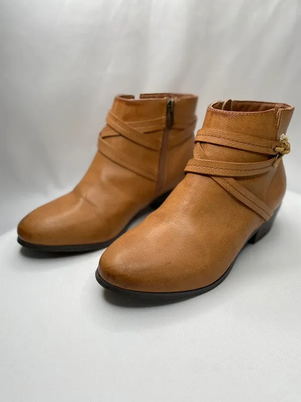 Brown faux leather ankle boots with no brand name, size 5.